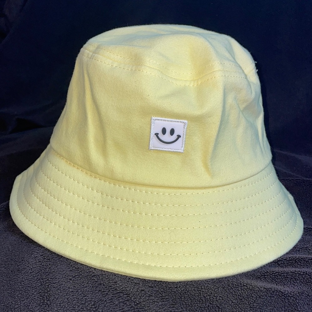 Yellow smiley face bucket hat